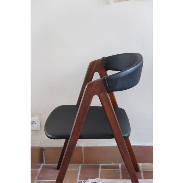 A pair of Danish dining chairs of the 1960s, attributed to Thomas Harlev for Farstrup Møbler, model 205. Solid teak...