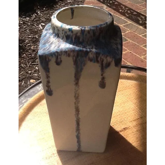 This pretty piece of art pottery shows off its splashes of blues and purples on a pristine white background. Its color...