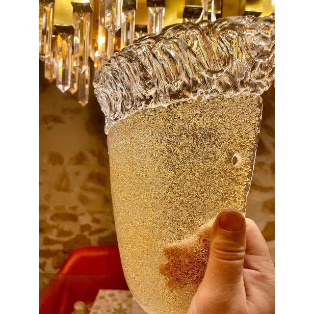 Exceptional Toso wall lighting glass Murano with metal structure. The Design and the quality of the glass make this piece...