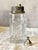 A refined vintage cocktail shaker featuring a cylindrical body in thick cut crystal. The glass is distinguished by its...