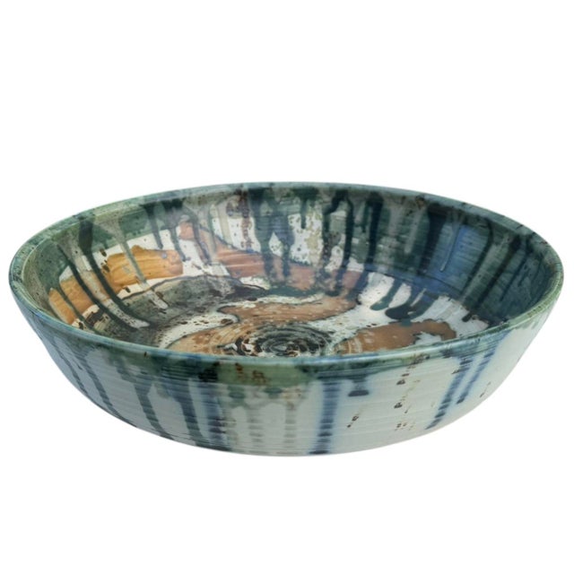 Beautiful hand-thrown studio pottery bowl signed Phelps and dated 1992. Expressive layered glaze in shades of green, blue,...