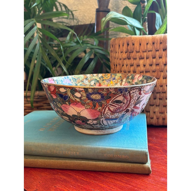 1980s porcelain 8" Rose Medallion bowl. Features hand-painted Chinese scenes of life surrounded by the beauty of colorful...