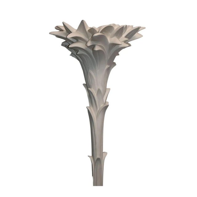 A Serge Roche style standing floor lamp featuring a tall sculptural faux bois trunk with layered, palm like foliage at the...