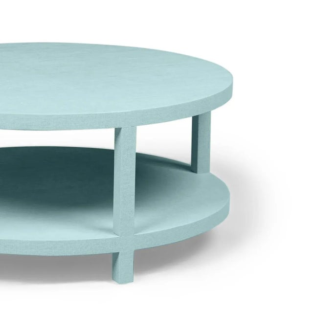 Raffia Wrapped Dolphin's Cove Round Two-Layer Coffee Table This round-open coffee table is beautiful and convenient. The...