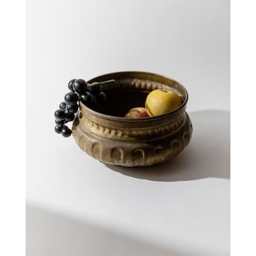 This vintage 1960s brass fruit bowl or planter features a classic, well-balanced form enriched with subtle decorative...