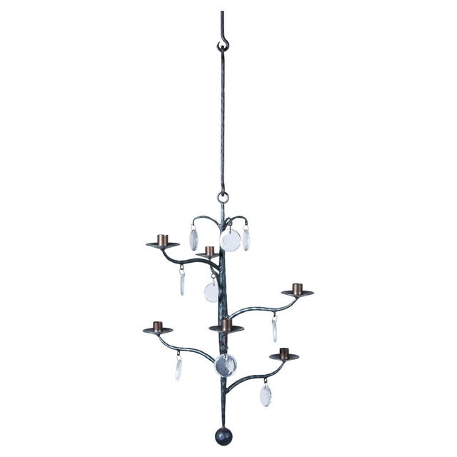 An elegant chandelier hand-forged chandelier with 6 arms for 6 candles and glass, designed by Swedish artist Erik Höglund...