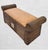 A beautiful pencil reed and wicker flip top storage bench. The bench features thick rolled arms with a brown stained...