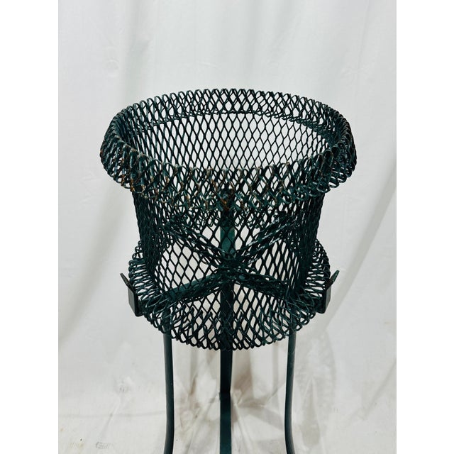 Charming mid 20th century plant stand in two parts: an expanded metal mesh jardinière basket with rolled rim and...