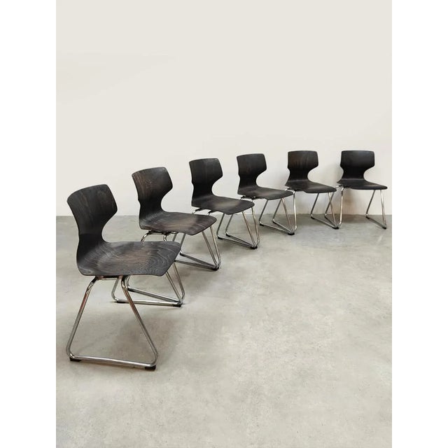 Sleek, stackable, and timeless. These vintage Pagwood chairs by Flötotto from the 1960s are a textbook example of...