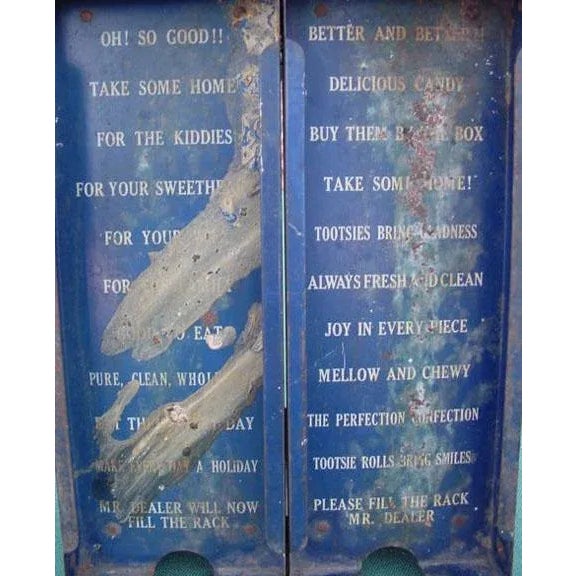 This is an old grocery general store metal counter dispenser for chocolate Tootsie Rolls. Features two front slots for...