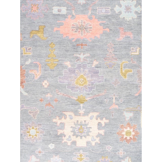 Expertly hand-knotted from fine wool, this Turkish Oushak rug showcases the collection's signature large-scale semi-...