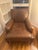 Beautiful oversized genuine leather lounge chair in a warm distressed cognac brown color. Extremely comfortable and deep-...