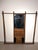 A highly decorative antique wooden billiard cue stand , combining practical cue storage with a central mirror and...