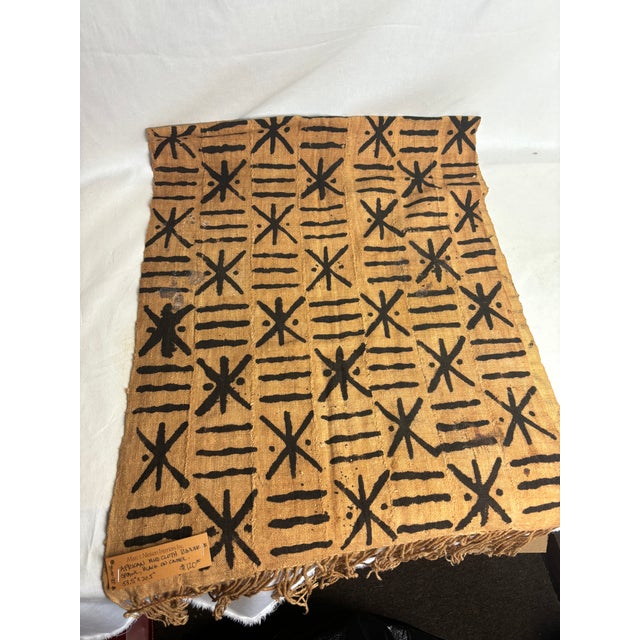 This African Mud Cloth is perfect for accessorizing yourself or your home. The natural tan material with black accents and...