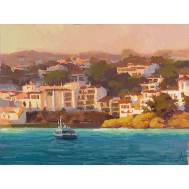 In "A Hora Májica," vibrant hues of orange and gold wash over a serene coastal scene, capturing the soft glow of twilight....