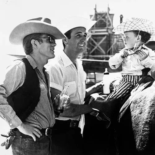 James Dean with a Bottle of Coca-Cola Awesome candid image of actor James Dean on the set of "Giant". He is captured here...