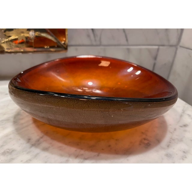 Simple sophistication with this large orange catchall bowl with slight gold flecking. No markings - in the style of Murano...