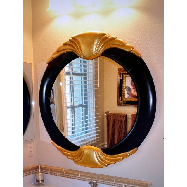 Beautiful Black and Gold Mirror that can be used in many areas of a home or office. This Mirror was purchased at a very...