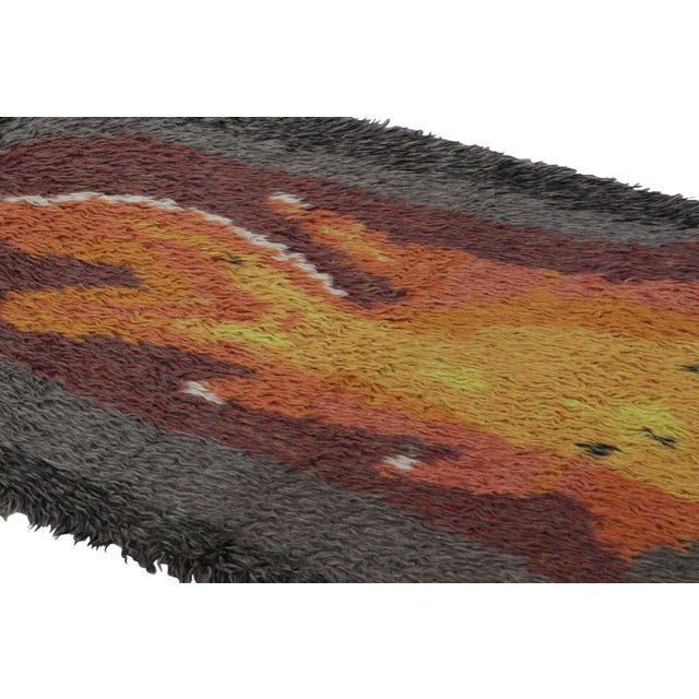 Hand-knotted in lush, high-pile wool in Sweden circa 1960-1970, this 3x5 vintage Swedish Rya rug is a bold new addition to...