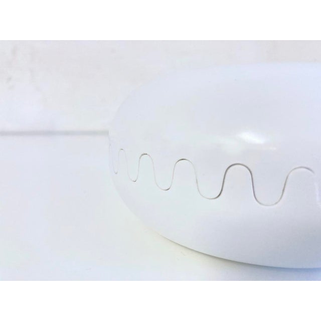 Two-part nesting ashtray or serving dish from the 1970s, designed by Alan Fletcher for Mebel, Italy. Plastic. Good used...