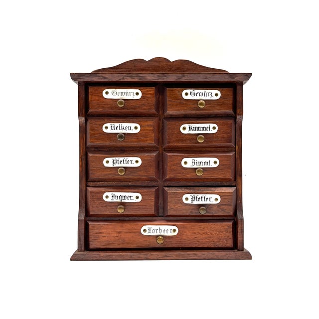 Charming spice cabinet/mini apothecary cabinet for wall mounting or freestanding use. The body is made of dark-stained...