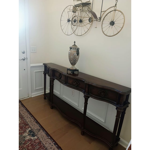 Make a grand impression in a compact space with the 72-inch Hall Console Table from Hooker Furniture. This stunning piece...