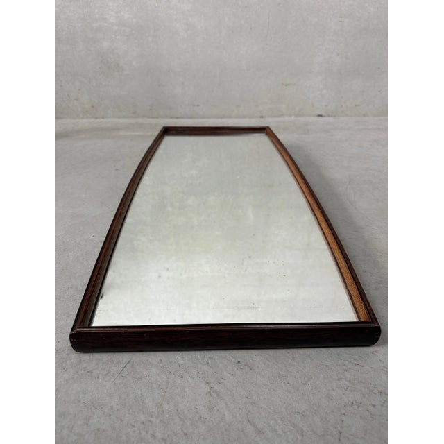 Vintage mirror in a fine wooden (rosewood) frame. Slightly unusual shape. Mirror shows some minor age spots (see last...