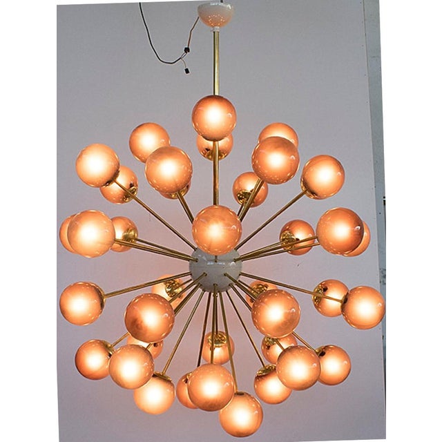 Italian sputnik chandelier with 40 frosted amethyst Murano glass globes mounted on brass frame in lacquered polished brass...