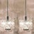 A pair of very modern, elegant and fine kinkeldey chandeliers. Really heavy quality. They are comfortable with all decor...
