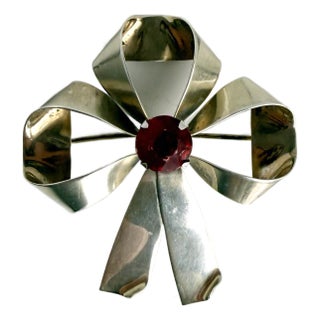 Sterling Silver Bow Brooch With Red Gemstone For Sale
