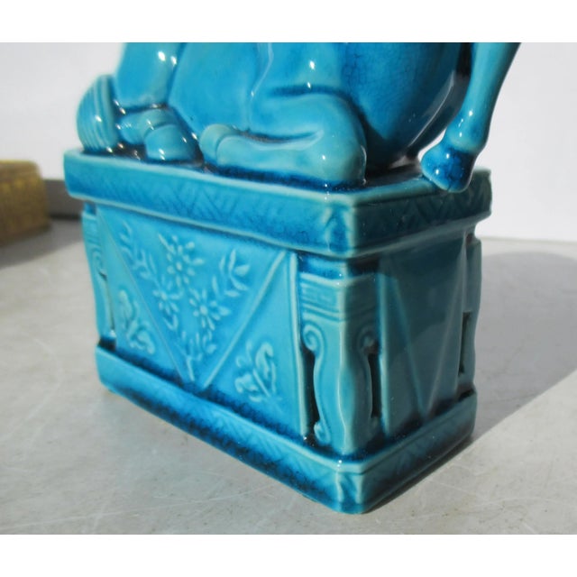 Vintage Chinese porcelain horse on a high diapered base. Turquoise glaze over the whole with a CHINA stamp to the bottom....