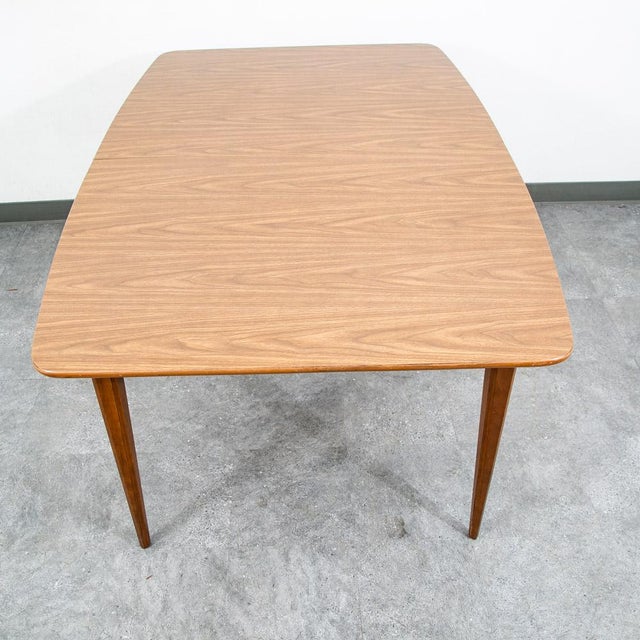 Walnut dining table with easy to clean surface. comes with 2 leafs. The frame is made up of stained oak. Well made classic...