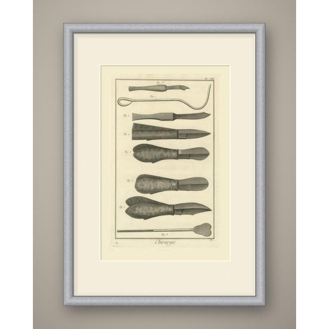 An original antique copper engraving, uncolored, laying out eight instruments in horizontal rows across the plate. At the...