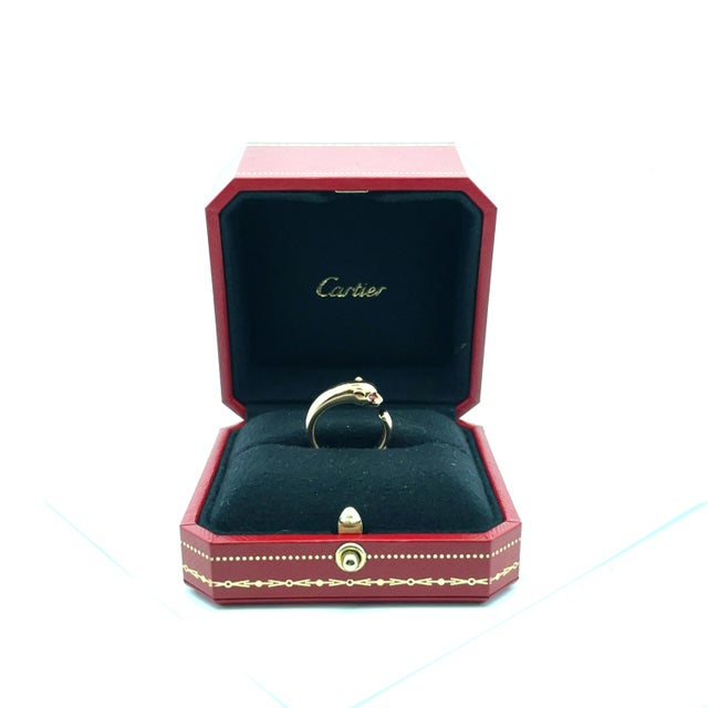 An authentic Cartier iconic Panthère de Cartier open cuff statement ring, crafted in polished 18k rose gold (pink gold)....
