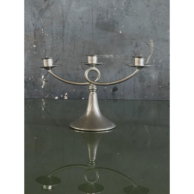 Pair of triple candlestick holders made by Plymouth KS Pewter. Stamped on underside.