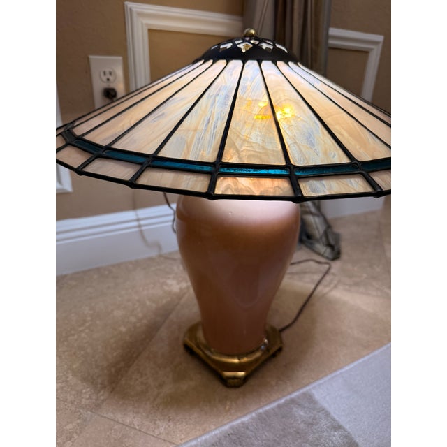 The product is a rare Mid-Century Vintage Crescent Brass Manufacturing Co. peach-colored lamp with a pagoda-shaped slag...