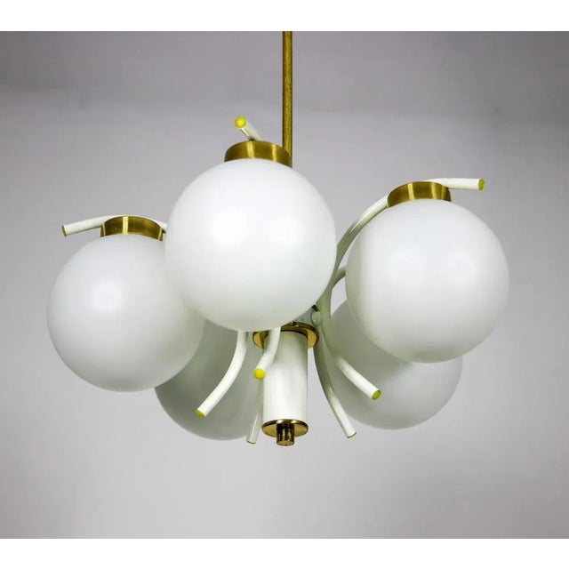 This vintage item remains fully functional, but it shows signs of age through scuffs, dents, faded finishes. The bulb...