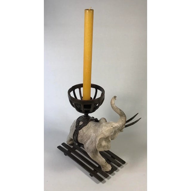 This good luck Elephant Candlestick of cast concrete with a grey wash finish Carries a metal basket with a taper candle...