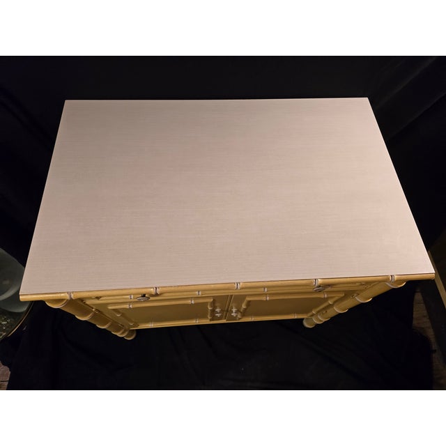 Thomasville Allegro yellow faux bamboo cabinet with one drawer, laminate top, and 2 shelves inside cabinet doors. This is...