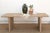 The Bastide keeps its proportions even and its details honest. Two solid panel legs carry the top, no stretcher bar, no...
