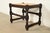 A beautiful antique English Jacobean or Tudor style stool or ottoman In the manner of Berkey & Gay USA, Circa 1920s Turned...
