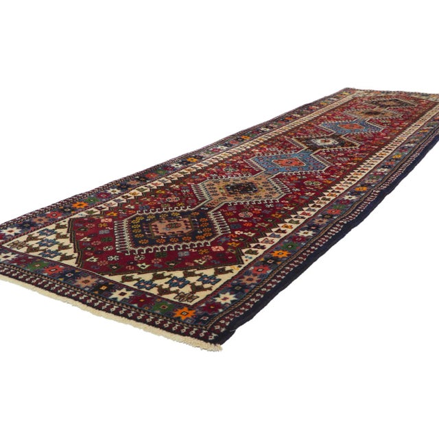 61044 Vintage Persian Shiraz Runner with Tribal Style, 02'10 x 10'07. Full of tiny details and a bold expressive design...