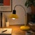 Vibrant in its sunny yellow, this Veneta Lumi desk lamp embodies the essence of 1970s Italian design's penchant for color,...