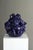This signed John Rezner cobalt blue ceramic vase with screaming faces is an extraordinary and provocative work of organic...