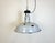 This industrial lamp was made in former Czechoslovakia during the 1950s. It features grey enamel shade with white...