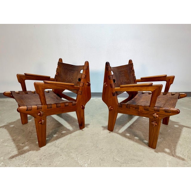 Set of 2 Hand Tooled Leather Sling Safari Lounge Chairs by Angel Pazmino, Ecuador, c. 1960's, original metal tags on front...