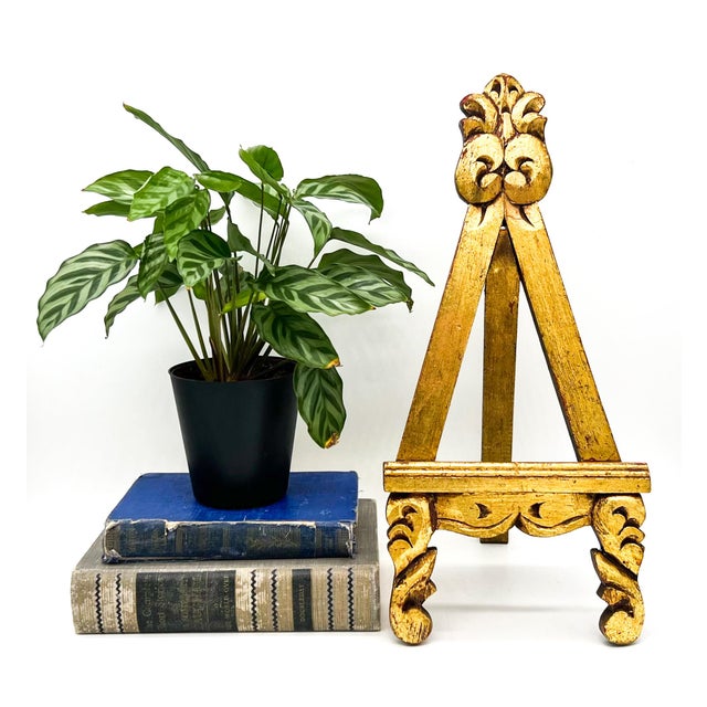 Charming, hand-carved tabletop easel featuring a richly detailed giltwood-style finish and classic European-inspired...