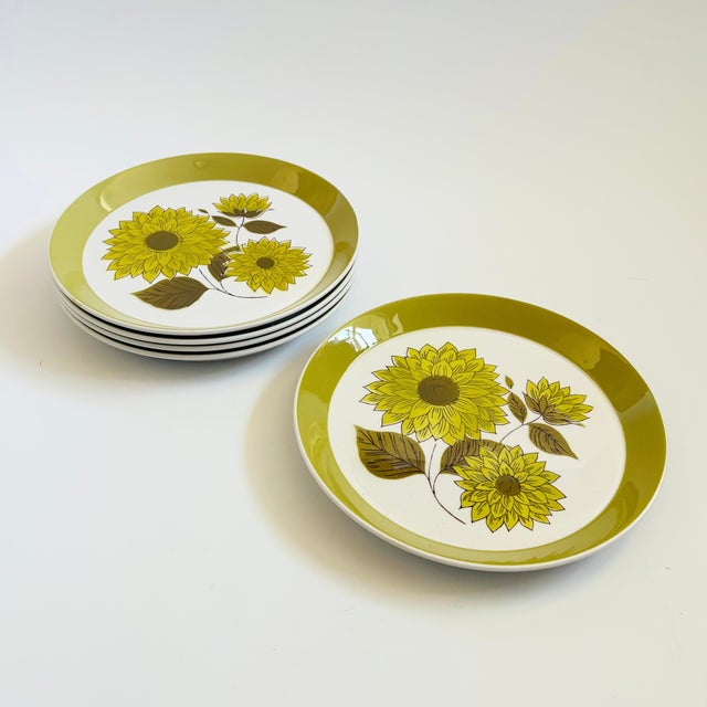 A set of 5 mid century ceramic salad plates by Mikasa in the "Duplex Dahlia" pattern. Glossy glazes with green rims and a...