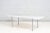 Carrara Marble Dining Table with stainless steel legs. Designed by William Katavolos, Ross Littel, and Douglas Kelly....