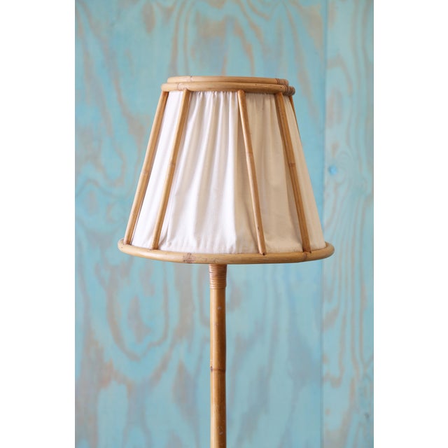 A vintage Swedish floor lamp in rattan and cane with a linen shade. Great coastal boho modern vibes. Unique design, you...